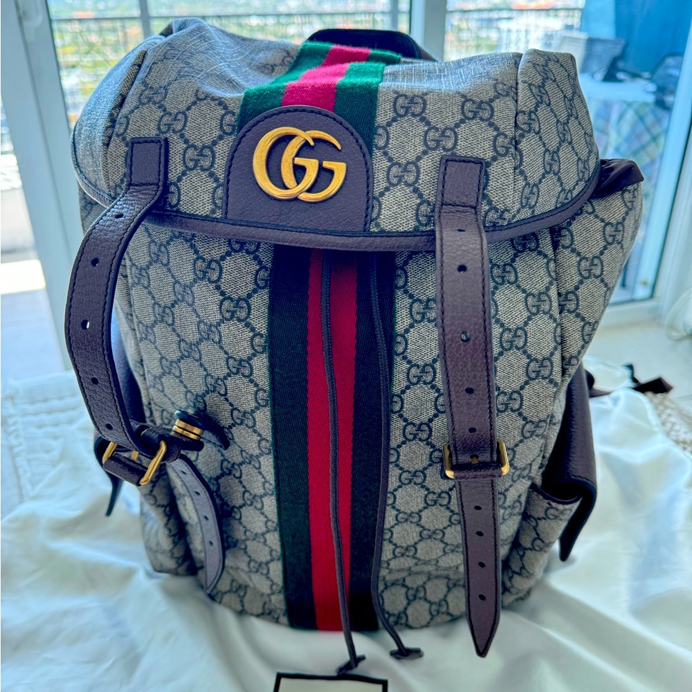 Gucci medium Ophidia backpack. Medium use comes with original dust bag